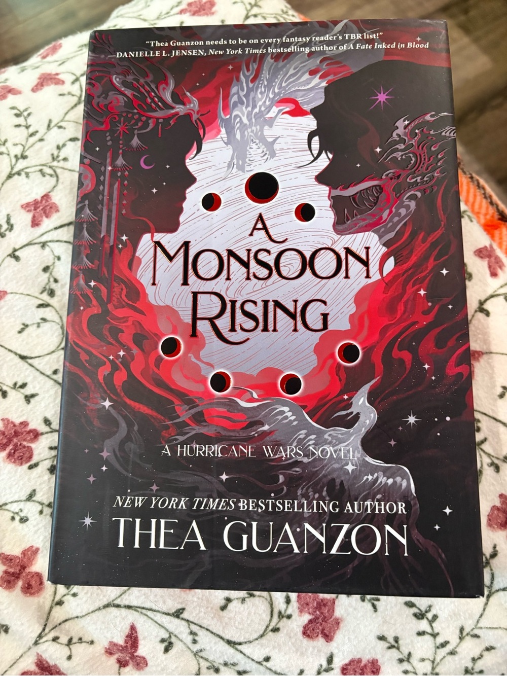A Monsoon Rising by Thea Guanzon - Red & Black Hardcover